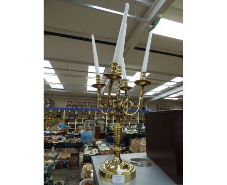 A brass four branch, five light candelabrum, with scrolling fish head arms; together with an Edwardian oak stationary box (2)