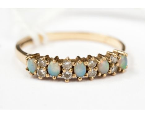 An opal and diamond ring on a 9ct gold band 