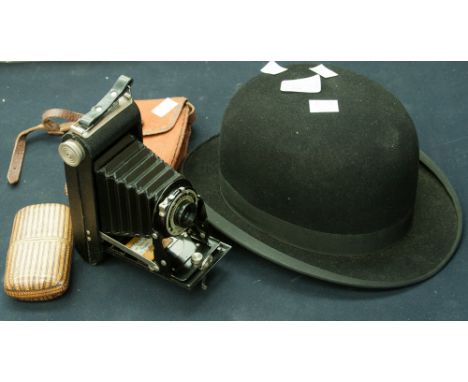 Ellis and Sons Burton on Trent Falcon bowler hat, circa 1950s, a decorated straw cigar case and a Kodak folding Brownie six-2