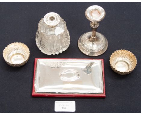 A dressing table cut glass bottle Edwardian with sterling silver collar, a short filled London silver candlestick and two Con