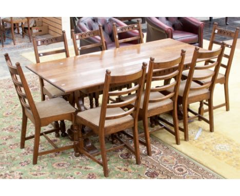 A traditional oak dining table and a matching set of eight chairs of ladder back form (9)