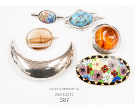 A collection of silver brooches and pendant including crescent, amber brooch, agate, base metal, enamel brooch, style of Bern