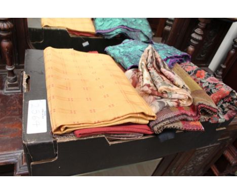A large box of remnants to consist of purple and jade pleated fabric, mustard check, floral velvet on black background, a sea