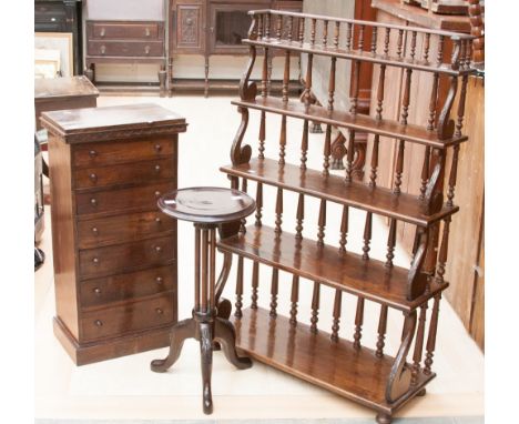 A mahogany tripod wine table, the circular top raised on a three column support and standing on three cabriole legs