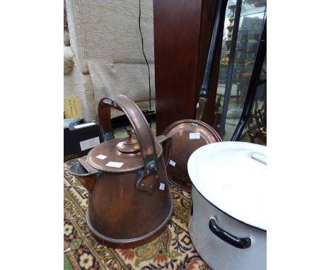 A late 19th Century copper kettle in all modernist style. Copper warming pan, enamel bread bin and a rug beater (4)