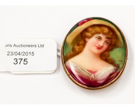 An oval portrait miniature brooch on porcelain, signed by Leslie Johnson (to the front and reverse) depicting Lady with long 