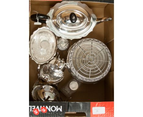 A collection of silver plate, comprising a three piece tea service, two dressing table jars, a silver capped jar, a butter di