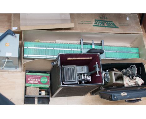 Two knitting machines (Tur Mix SV577 and Trumeter Co Ltd) a small leather suitcase, Paillard Bolex projector, Aldis projector