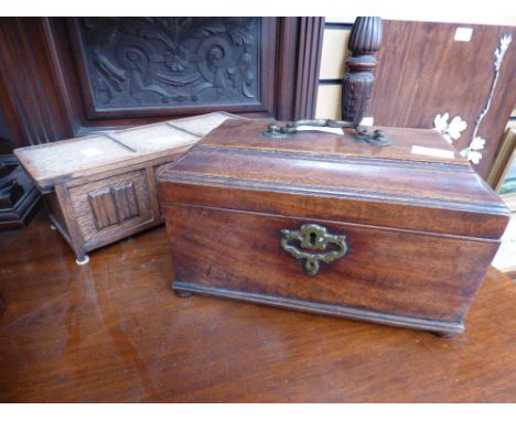 A mahogany tea caddy with brass carry handle 19th Century and an oak cigarette box (2) 