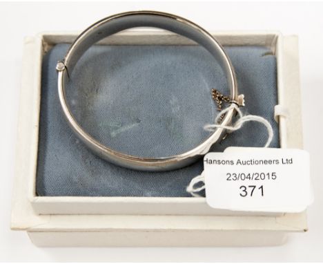 A hallmarked silver bangle (1) 