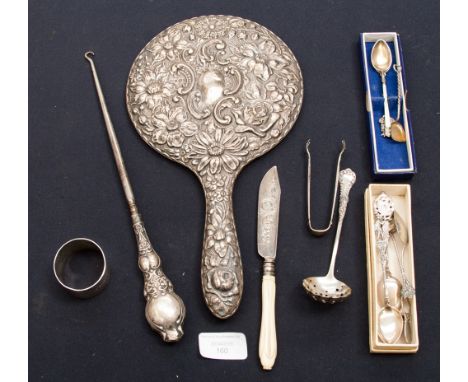 A collection of various silver, comprising dressing table mirror, with a floral embossed back, Birmingham 1913, plus a napkin