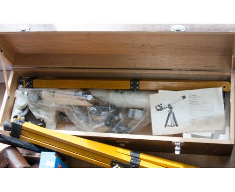 A boxed telescope with tripod