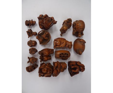 A Japanese Netsuke, late 19th and 20th Century, many signed, some with moving parts (17) 