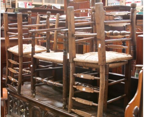 A set of five early 19th century ash and elm rush seated ladder back chairs,  attributable to the North West, comprising armc