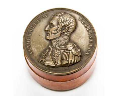 A lacquered amber effect snuff box set with Duke of Wellington medallion to the top and the reverse of the medal to the base 