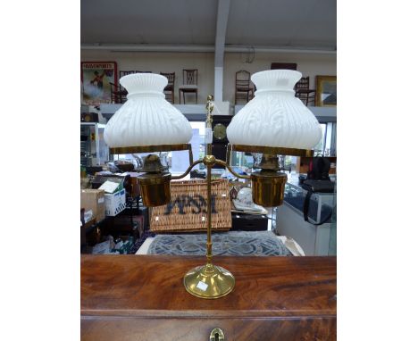 A late 19th century brass two-branch oil lamp, each branch fitted with a opaque moulded glass shade with adjustable action, 5