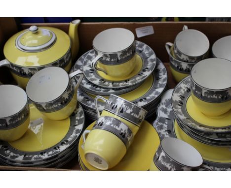 A Foley china black transfer and yellow ground reg no. 699742 (271) tea service, with additional serving plates and sandwich 