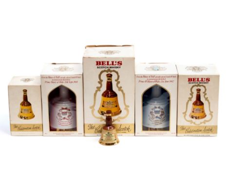 A collection of Bells whiskey in ceramic decanters. Including Prince Harry, celebration scotch, Prince William and miniature 