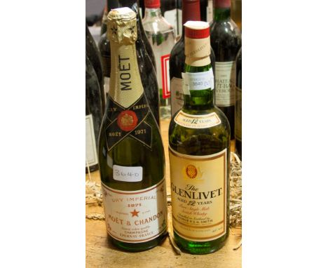 A bottle of Glenlivet, pure single Malt Scotch Whisky; together with a bottle of dry imperial 1971 Moet of Chandon (2) 