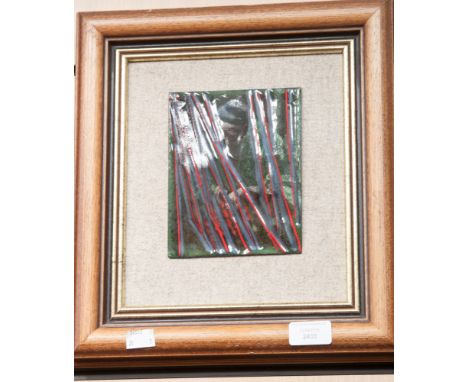 A contemporary enamel plaque of rectangular form, green, red and black figural and abstract design of a woman knitting, 16cm 