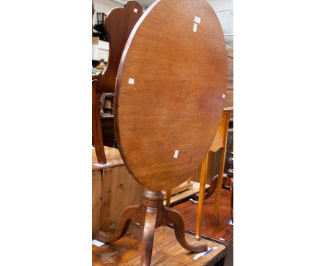 A 19th century mahogany tripod table, with a tilt-top