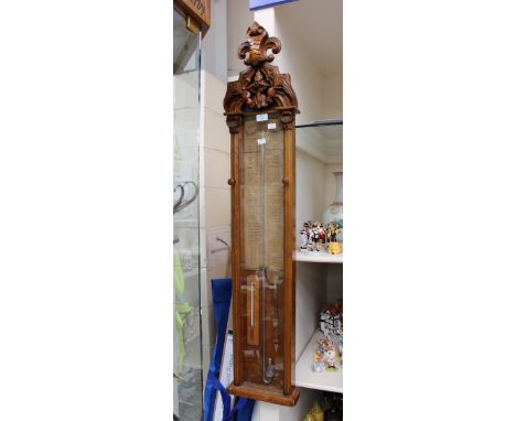 An Admiral Fitzroy barometer in oak case

