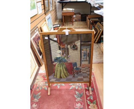 Three various 20th Century mirrors, all with bevelled edge glass; together with a woolwork firescreen (4) 