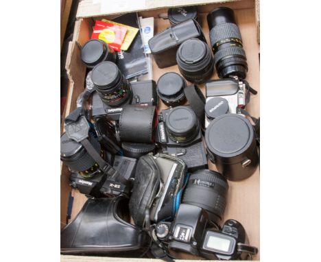 A box of assorted 35 mil vintage camera; including Mamiya, with 200 m lenses, Canon, Sigma lenses, instruction books, etc (on