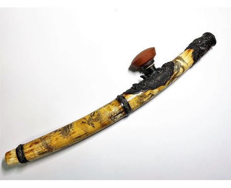 A Chinese decorative ivory opium pipe, early 19th century, mounted with a ruyi shaped white metal panels engraved, approx 18"