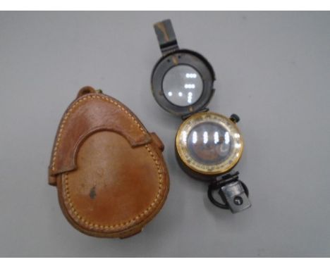 Military field compass in leather case