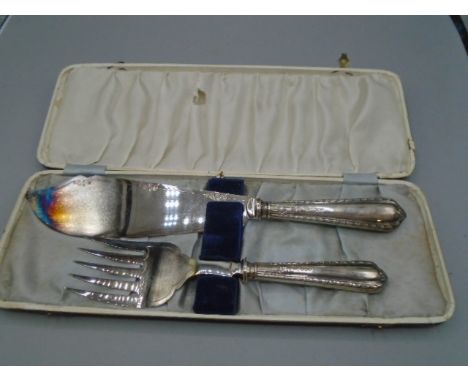 Silver handled fish knife and fork plus 3 silver tea spoons, all hallmarked