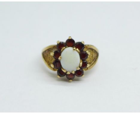 A 9ct gold, opal and garnet ring, 4.3g, O 