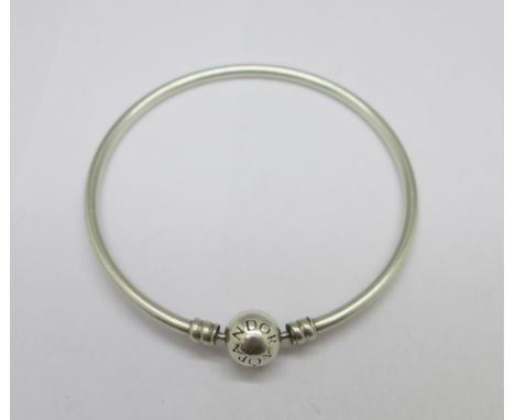 A silver Pandora bangle 