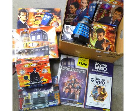 A collection of vintage Doctor Who merchandise and games, including a radio controlled Dalek 