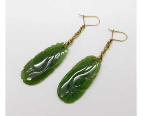 A pair of carved jade earrings, jade 16mm x 36mm 