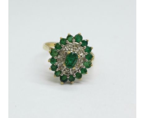 A 9ct gold, emerald and diamond cluster ring, 3.3g, O 