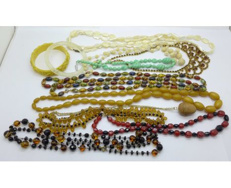 A collection of costume bead necklaces including Bakelite and mother of pearl 
