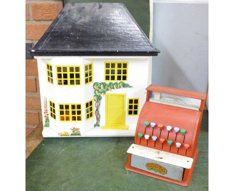 A dolls house and furniture and a vintage Codeg child's till 