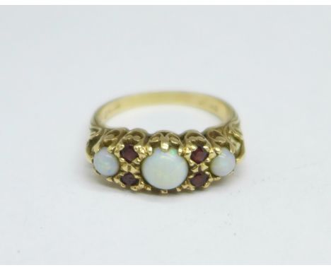 A 9ct gold, opal and garnet ring, 3.4g, O 