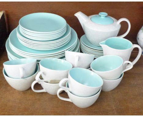 Poole Pottery tea wares, teapot, ten cups, eight saucers, twenty plates of various size, cream and sugar 