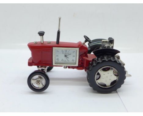 A small novelty desktop tractor set with a timepiece marked William Widdop, length 10cm 