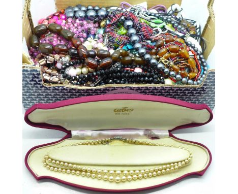 Assorted necklaces, including a faux pearl necklace with silver clasp 
