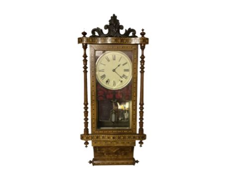 New Haven - American late 19th-century 8-day walnut and parquetry inlaid wall clock, with a carved pediment over a fully glaz