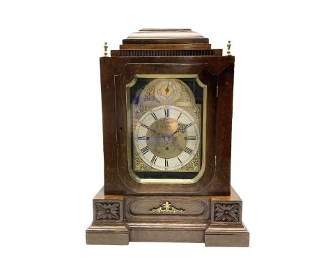 English oak cased bracket clock - in a late 19th-century case with a brass dial inscribed Thwaites, London, with a flat-toppe