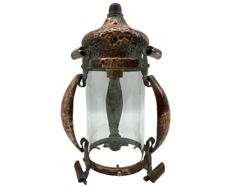 Arts &amp; crafts copper hall lantern, of cylindrical form with pagoda style pierced top and scrolling strapwork frame, H25cm