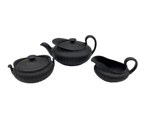 19th century Wedgwood black basalt three-piece tea set, each of semi fluted form comprising teapot, sucrier and milk jug 