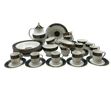 Royal Doulton 'Carlyle' pattern table ware comprising eight coffee cans and saucers, coffee pot, seven tea cups and saucers, 