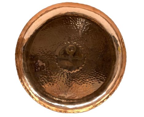Newlyn copper tray, of circular form with scalloped rim and hammered surface, stamped D29cm 