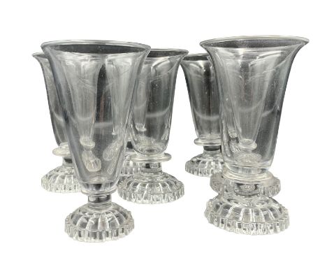 Matched set of seven Georgian jelly glasses, with plain trumpet bowls, petal edged foot and lemon squeezer bases, H11.5cm max