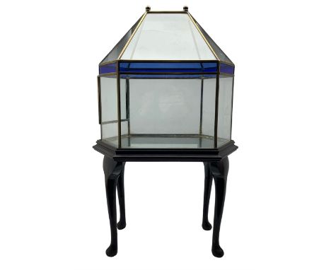 Victorian style hexagonal glass terrarium, of architectural form with blue stained glass panels, two brass knop finials and f